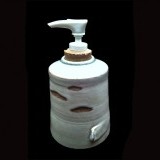 Soap pump 7-8" with cork stopper and white plastic pump.